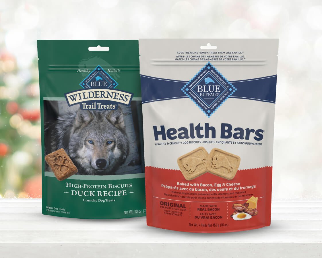 Two Blue Buffalo dog treat packages: Wilderness Trail Treats and Health Bars