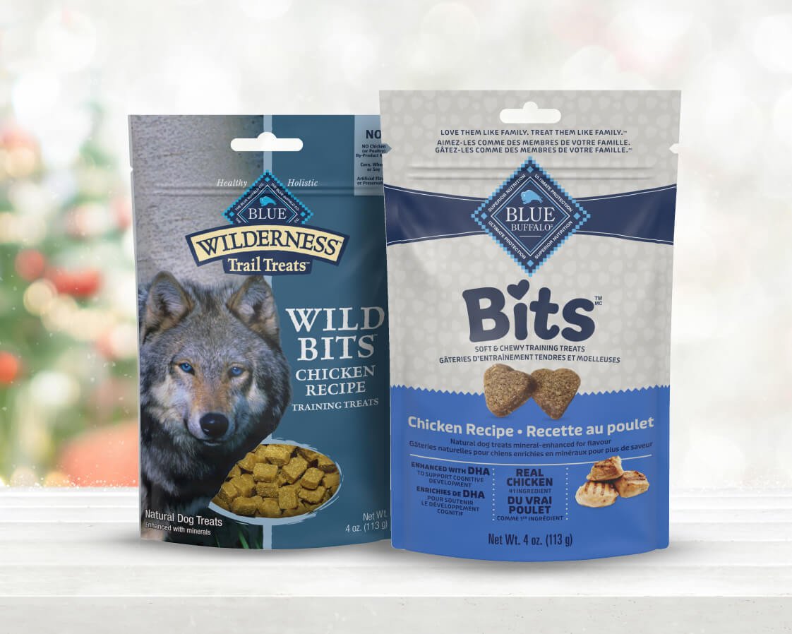 Two dog treat packages: Blue Wilderness Wild Bits and Blue Buffalo Bits Chicken Recipe