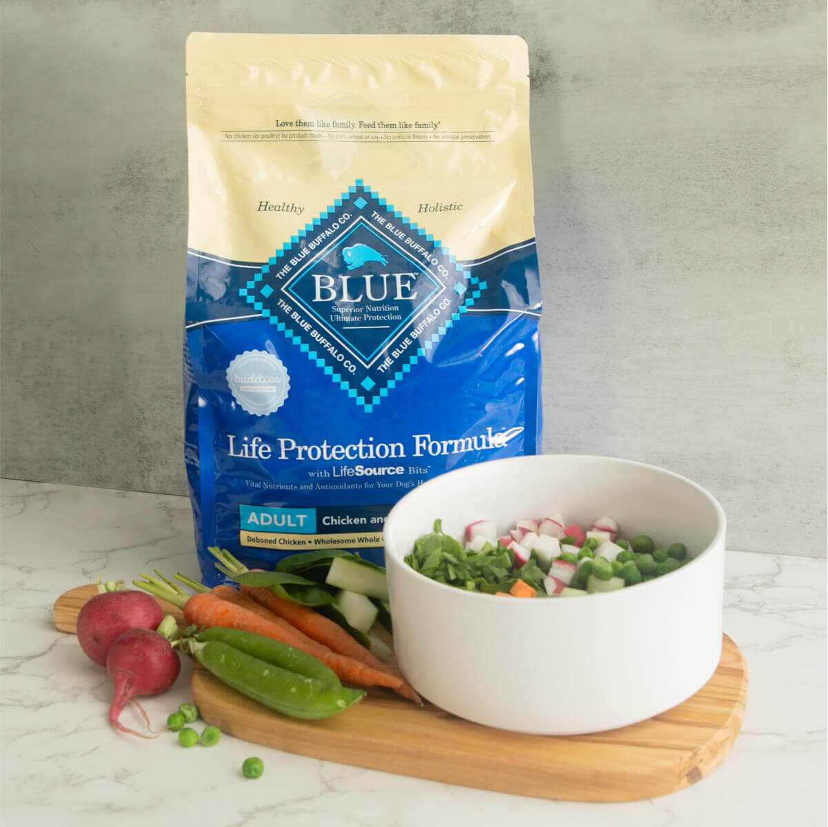Nutrient-rich Blue Buffalo Life Protection Dog Food along with a white bowl showcasing a healthy and delicious ingredients, perfect for your dog's springtime health