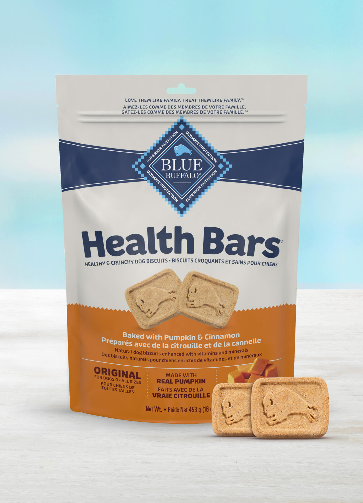 A package of Blue Buffalo Health Bars, baked dog biscuits with pumpkin and cinnamon, emphasizing natural ingredients and suitable for dogs of all sizes.