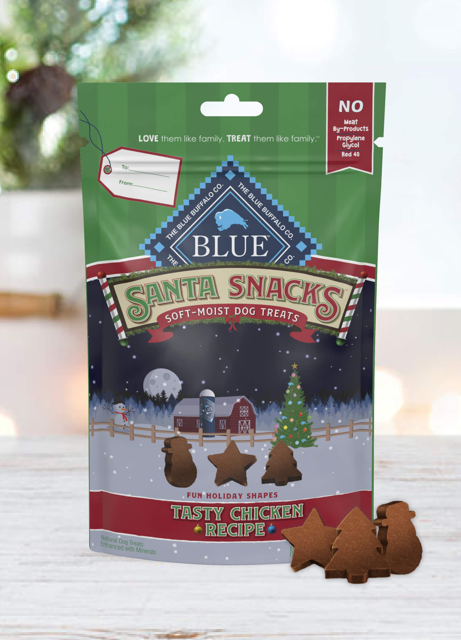 A pack of BLUE Santa Snacks Bits is behind a few Santa Snacks Bits in shapes of a star, a Christmas tree and a snowman.